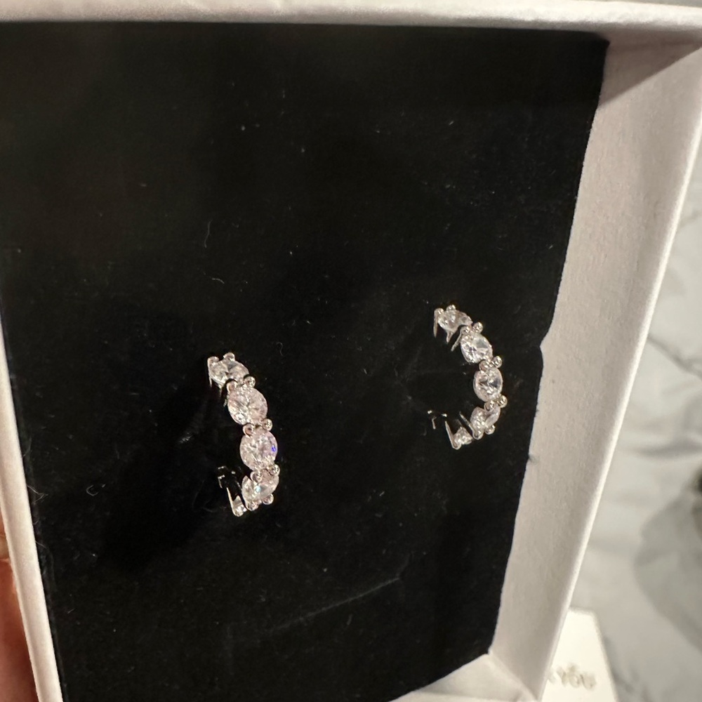 Beautiful Moissanite Huggies set in .925 sterling silver.